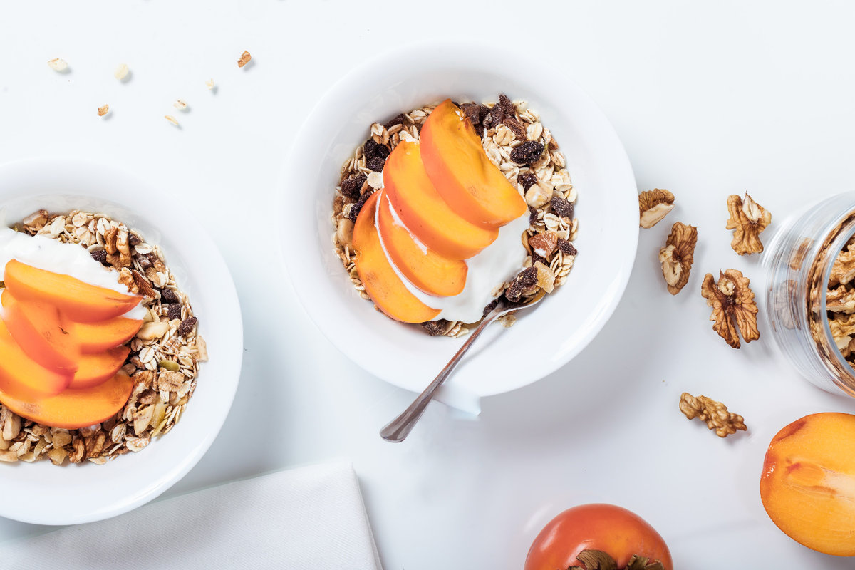 two bowls of oatmeal with peaches